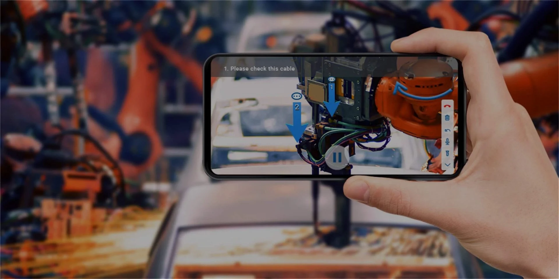 手持手机，屏幕显示增强现实（AR）视图，指导检查机器人臂部的电缆连接，背景为模糊的工业环境。