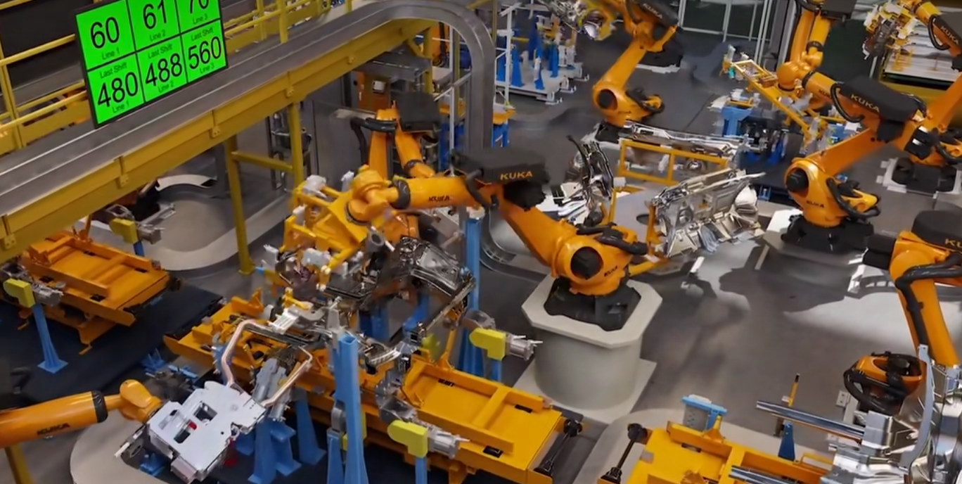这是一个现代化机器人自动化生产线，多个黄色机械臂在进行工业制造作业，背景显示着数字化监控数据。