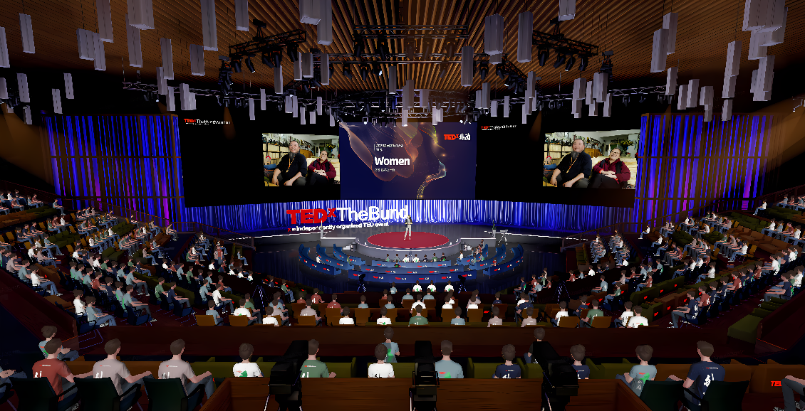 这是一张模拟TED演讲的场景图，讲台上显示“Women”，观众席上坐着许多听众，背景是室内现代化会场。