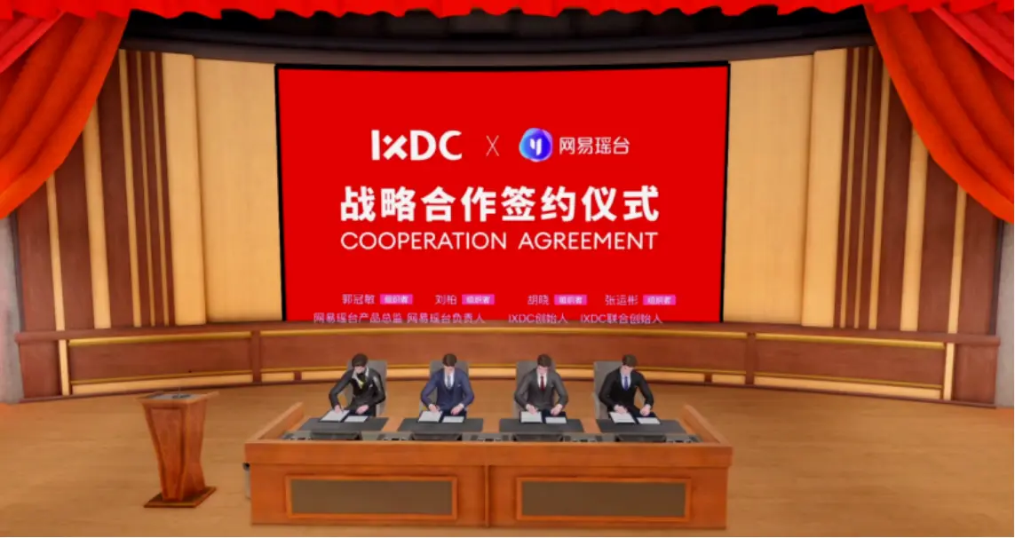 图片展示五人在会议室签署合作协议，背景为红色横幅，上写合作协议英中文字样，场合正式。