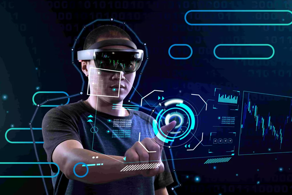 图片展示一位佩戴先进头戴式显示设备的人在虚拟现实中与数字界面互动，周围充满未来科技感的图形和数据。