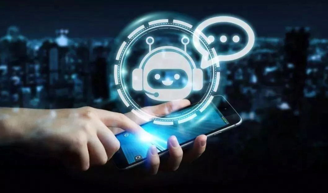 图片展示了一只手持智能手机，手机屏幕上浮现出一个代表人工智能的聊天机器人图标，背景是模糊的城市夜景。